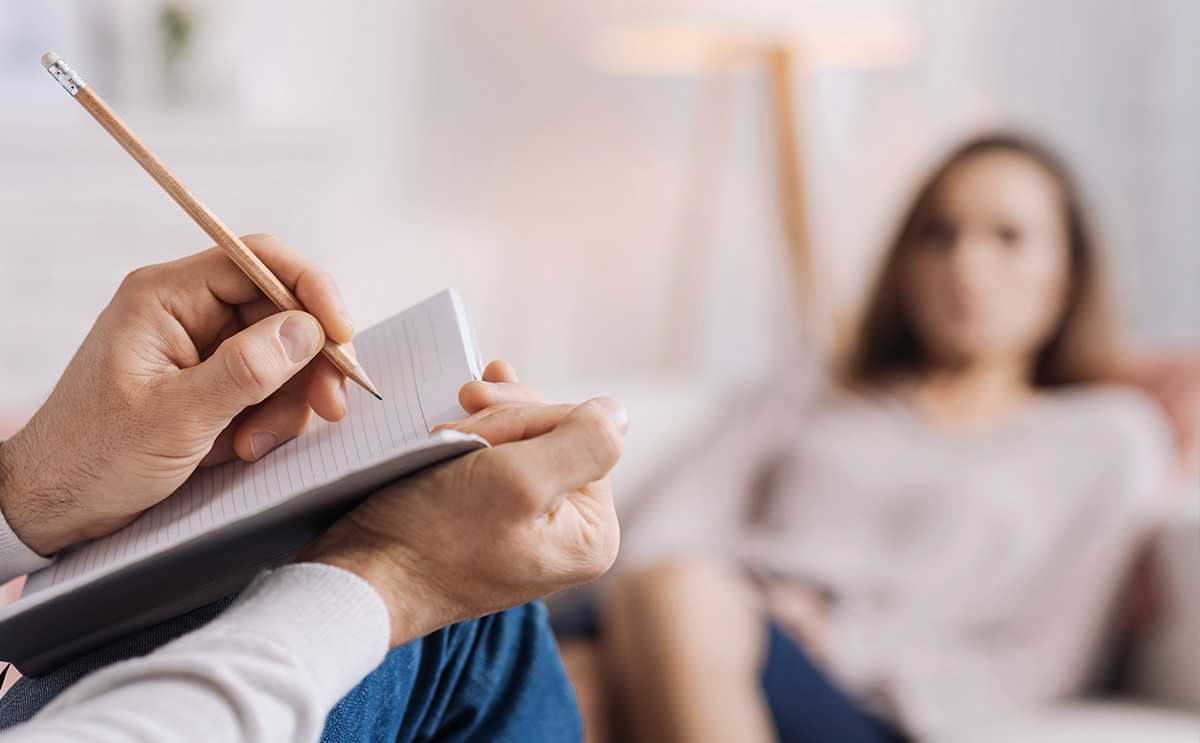 Picture of a man making notes