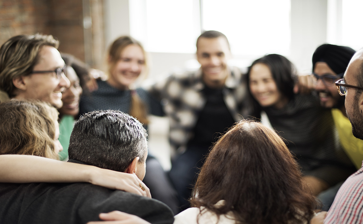 Group of people talking in a circle