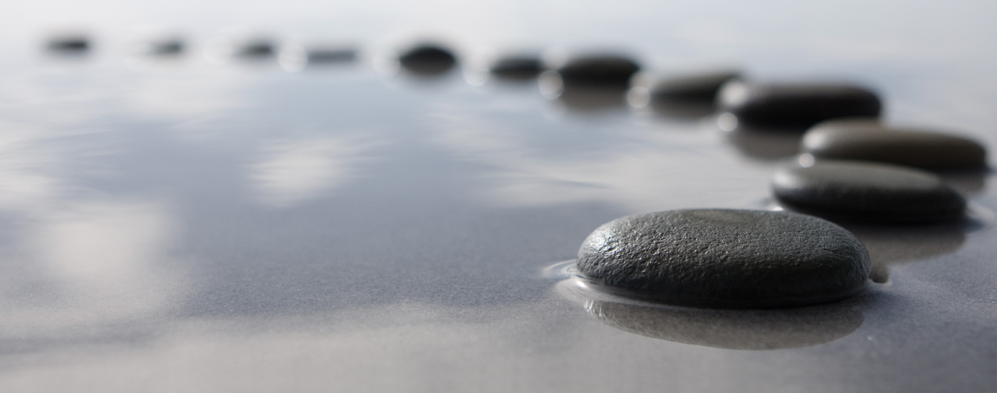 Stepping stones in water showing a path