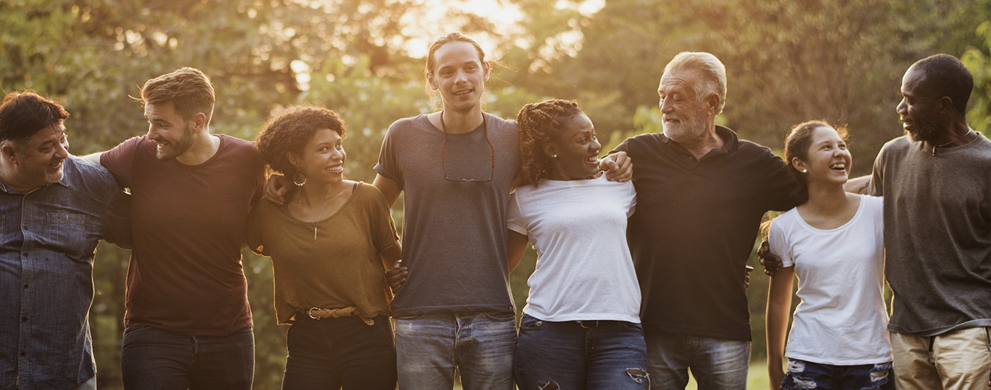 Group of people standing outside in a line