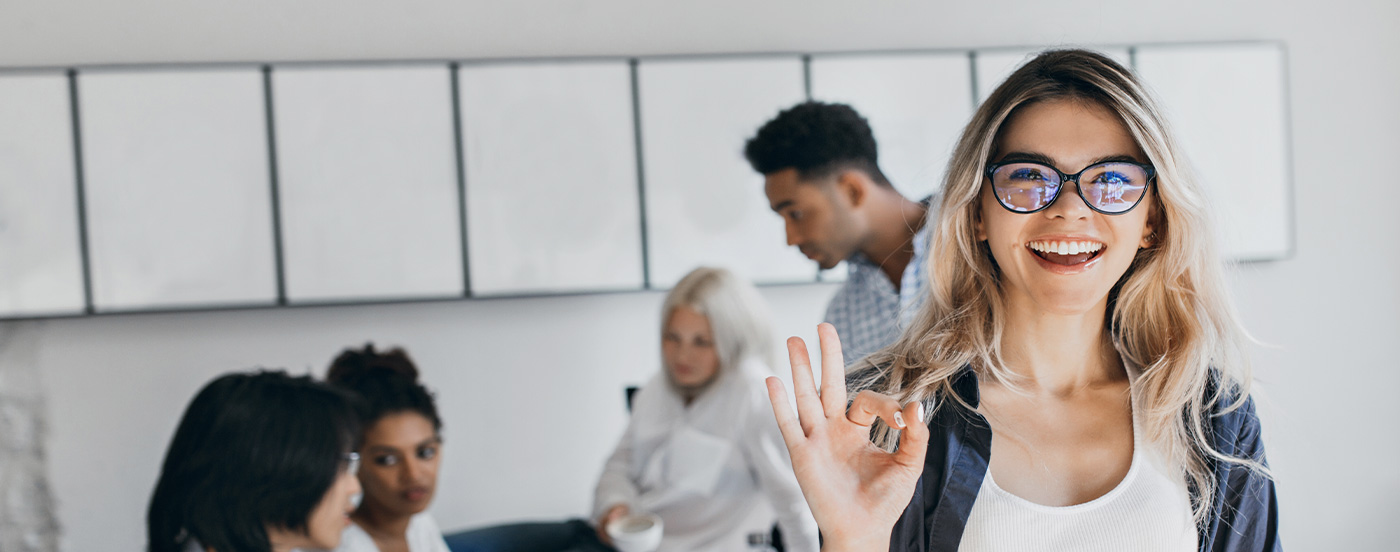 Lady looking at camera within a workplace environment